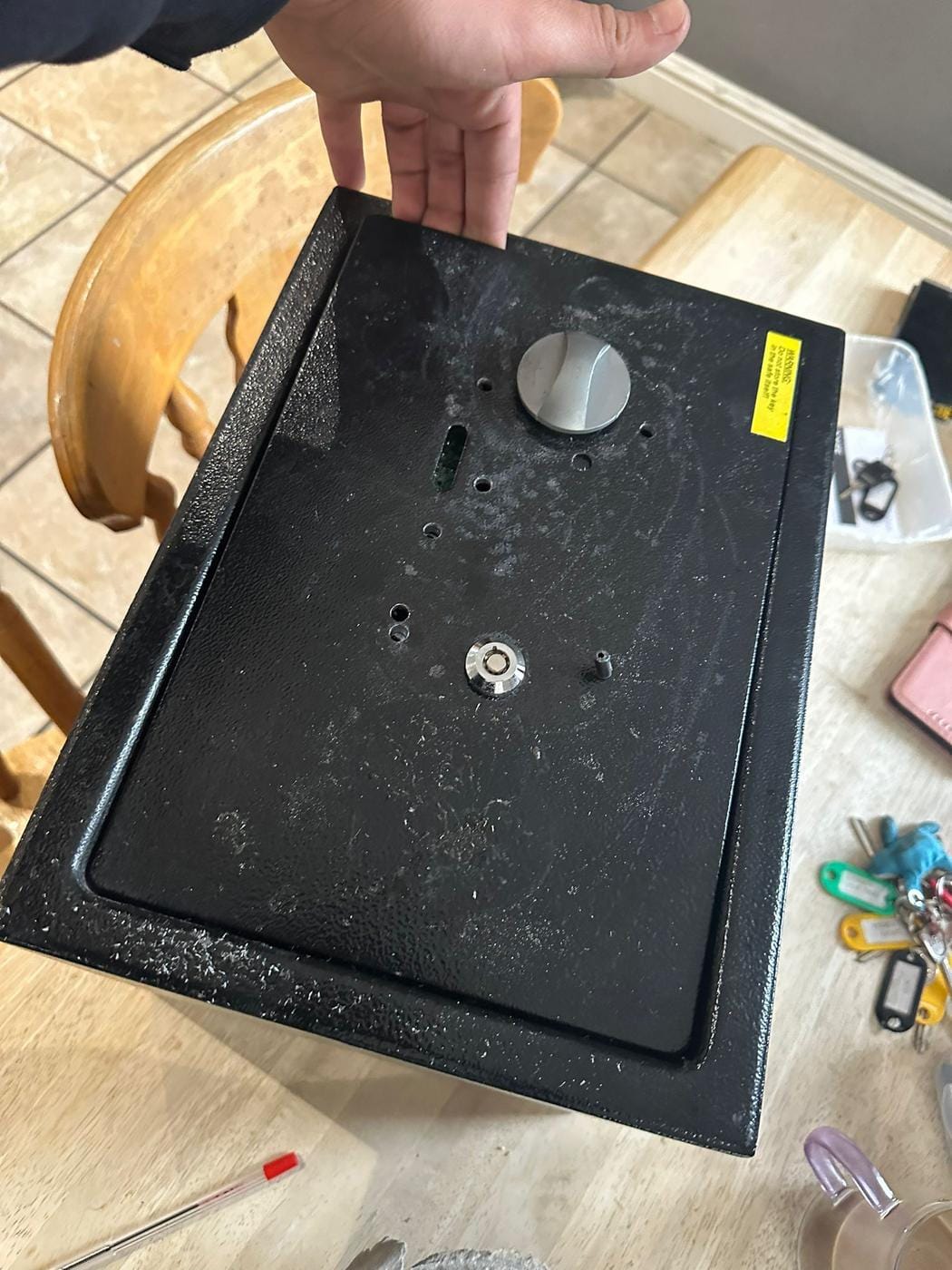 Black home safe opened, internal lock mechanism removed and visible — safe unlock service carried out.