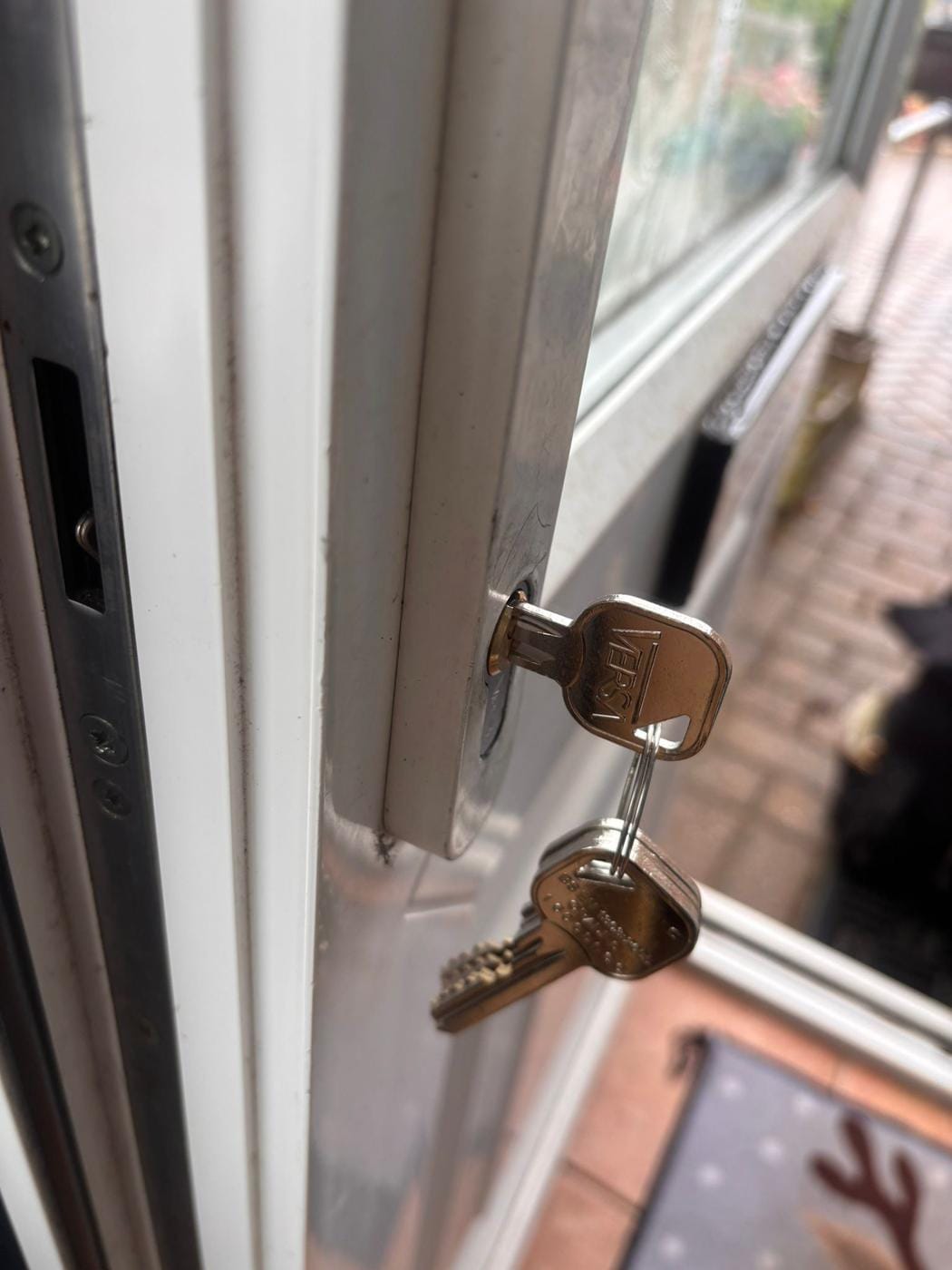 White uPVC patio door opened, Versa keys left in the cylinder after a non-destructive lockout entry.